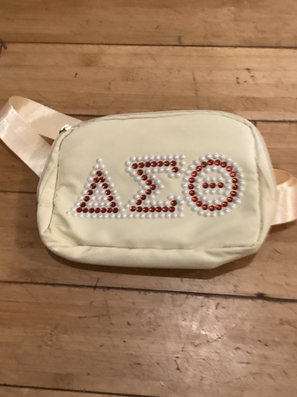 Cream Crossbody Belt Bag with Red and Pearl Bead Embellishment